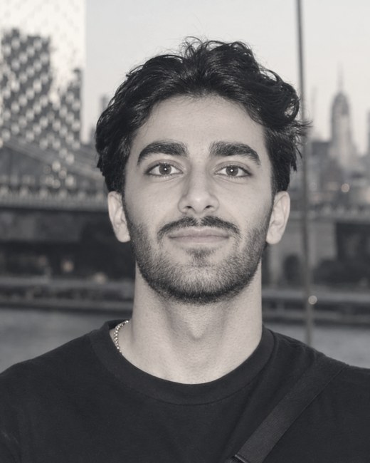Navid Armanfar, photographed in front of the Manhattan Bridge and the New York skyline.